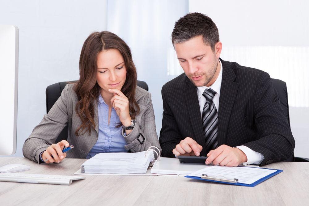 An Accountant from a CPA Firm Helps File a Client’s Income Tax Return