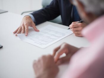 Business Owner Prepares IRS Documents with Accounting Firm